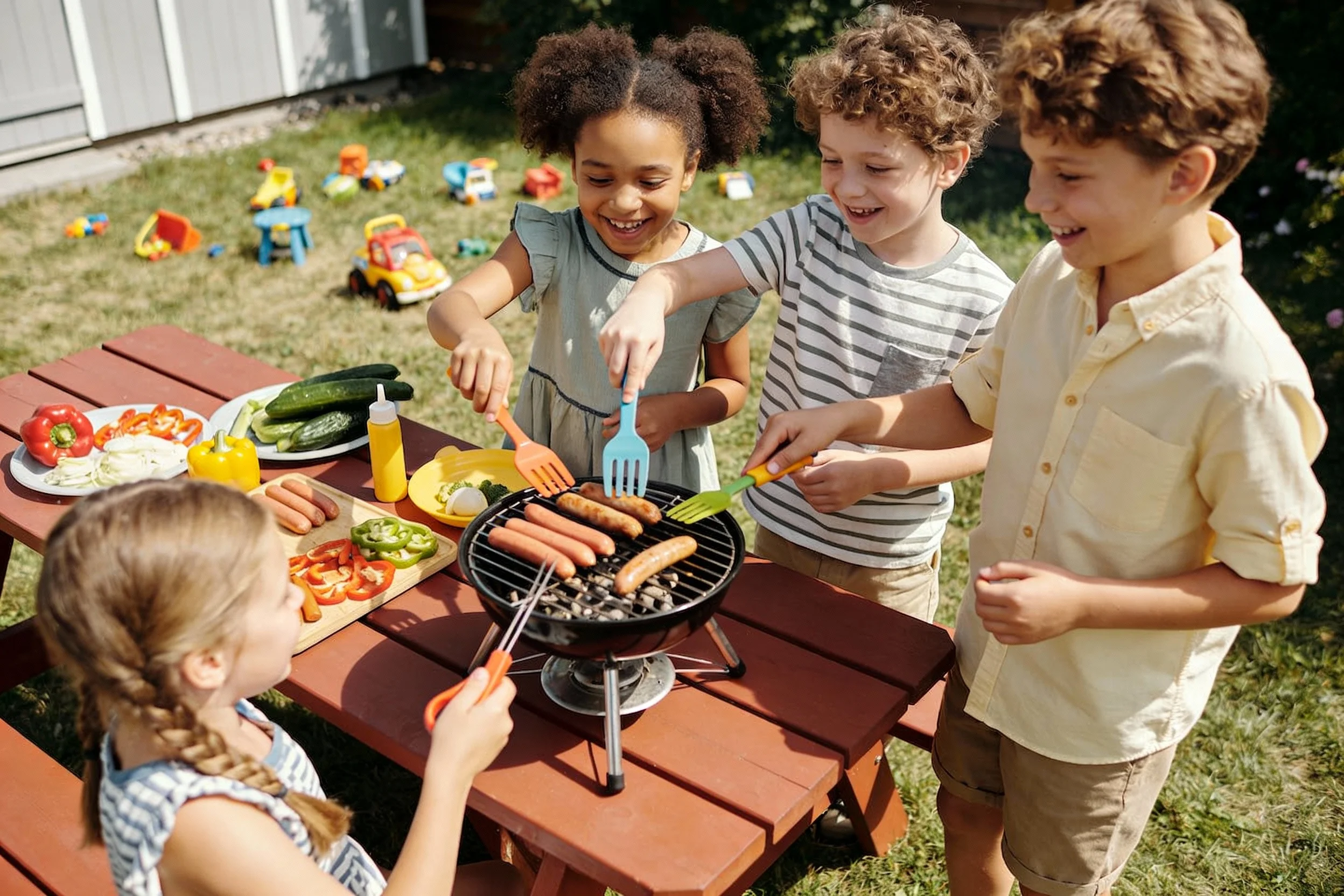 Kids enjoying a backyard cooking session